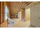 View of unfinished room featuring exposed wooden beams and construction, offering a blank canvas for creative renovation at 1005 Enderbury Dr, Raleigh, NC 27614