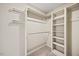 Spacious walk-in closet featuring custom shelving, organization, and clothing rods at 1005 Enderbury Dr, Raleigh, NC 27614
