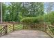 Back deck area offering an outdoor seating option with a decorative wood railing at 1006 Mingo Pl, Knightdale, NC 27545