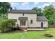 Back exterior of home with a deck, patio, and well-maintained yard at 1006 Mingo Pl, Knightdale, NC 27545
