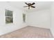 Carpeted bedroom with large windows and feature shiplap wall at 1006 Mingo Pl, Knightdale, NC 27545