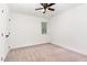 Carpeted bedroom features neutral paint and a large window at 1006 Mingo Pl, Knightdale, NC 27545