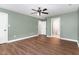 Bedroom with neutral walls, ceiling fan, and view into ensuite bath at 1006 Mingo Pl, Knightdale, NC 27545