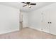 Bedroom with neutral paint, carpeted floor, and open closet at 1006 Mingo Pl, Knightdale, NC 27545