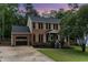 Charming brick home with manicured landscaping and an attached garage at 1006 Mingo Pl, Knightdale, NC 27545