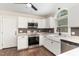 Bright, updated kitchen with white cabinets, stainless steel appliances, and granite countertops at 1006 Mingo Pl, Knightdale, NC 27545