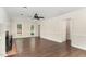 Open-concept living area with wood floors, neutral walls, and views into other rooms at 1006 Mingo Pl, Knightdale, NC 27545
