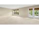 Finished basement with neutral carpet, recessed lighting, and view of greenery at 1034 Ventnor Pl, Cary, NC 27519