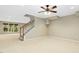 Finished basement area with staircase, neutral carpeting, and natural light at 1034 Ventnor Pl, Cary, NC 27519