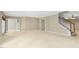 Large finished basement with neutral color palette, recessed lighting, and staircase access at 1034 Ventnor Pl, Cary, NC 27519