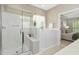 Modern bathroom with a glass-enclosed shower and a relaxing soaking tub at 1034 Ventnor Pl, Cary, NC 27519