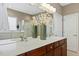 Bathroom featuring a double vanity, a large mirror, and a combination shower and soaking tub at 1034 Ventnor Pl, Cary, NC 27519
