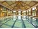 The indoor pool at the community center features high ceilings, skylights, and plenty of natural light at 1034 Ventnor Pl, Cary, NC 27519