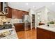 Well-equipped kitchen with stainless steel appliances, granite countertops and hardwood floors at 1034 Ventnor Pl, Cary, NC 27519