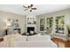 Cozy living room features a fireplace and windows that let in plenty of natural light at 1034 Ventnor Pl, Cary, NC 27519