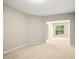 Neutral bonus room with plush carpeting, recessed lights, and window view of the yard at 1034 Ventnor Pl, Cary, NC 27519