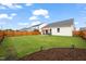 Expansive backyard featuring a patio with outdoor furniture, a privacy fence, and a lawn at 1109 Briar Gate Dr, Holly Springs, NC 27540