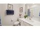 Bright bathroom with a white vanity, framed mirror, and coordinated decor at 1109 Briar Gate Dr, Holly Springs, NC 27540