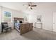A bedroom features a ceiling fan, carpet, natural light, and neutral paint at 1109 Briar Gate Dr, Holly Springs, NC 27540