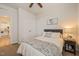 Neutral bedroom featuring carpet, a ceiling fan, and a bedside table with a lamp at 1109 Briar Gate Dr, Holly Springs, NC 27540