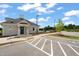 Attractive community clubhouse with convenient parking and a glimpse of the pool at 1109 Briar Gate Dr, Holly Springs, NC 27540