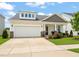 Charming home with stone accents, a manicured lawn, and well-maintained landscaping at 1109 Briar Gate Dr, Holly Springs, NC 27540