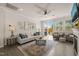 Bright living room featuring hardwood floors, neutral decor, and a sliding glass door to patio at 1109 Briar Gate Dr, Holly Springs, NC 27540