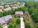Aerial view of a home with mature landscaping in a well-established neighborhood at 111 Revere Forest Ct, Cary, NC 27519