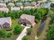 Expansive aerial view of a home with a well-manicured lawn, surrounded by trees at 111 Revere Forest Ct, Cary, NC 27519