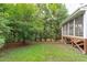 Lush backyard featuring mature trees and an outdoor shed at 111 Revere Forest Ct, Cary, NC 27519