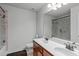 Well-lit bathroom featuring a double vanity and a tiled shower at 111 Revere Forest Ct, Cary, NC 27519