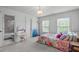 Cozy bedroom with ample natural light, vanity, and ensuite bath at 111 Revere Forest Ct, Cary, NC 27519