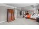 Spacious bedroom shows a large armoire and the bed with a door leading to the bathroom at 111 Revere Forest Ct, Cary, NC 27519