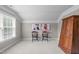 Bedroom with a large dark wood armoire, chairs, and neutral carpet and wall color at 111 Revere Forest Ct, Cary, NC 27519