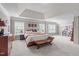 Large bedroom with lots of light, a seating area and comfortable decor at 111 Revere Forest Ct, Cary, NC 27519