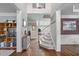 Inviting foyer featuring hardwood floors, staircase, and views into multiple rooms, creating an open and airy feel at 111 Revere Forest Ct, Cary, NC 27519