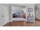 Spacious home office view showcasing the doorway, built-in shelving, a desk, and natural light at 111 Revere Forest Ct, Cary, NC 27519