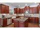 Kitchen with hardwood floors, stainless appliances, and island at 111 Revere Forest Ct, Cary, NC 27519