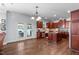 Open concept kitchen featuring hardwood floors, center island, and stainless appliances at 111 Revere Forest Ct, Cary, NC 27519