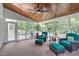 Relaxing sunroom filled with natural light, featuring wicker furniture at 111 Revere Forest Ct, Cary, NC 27519