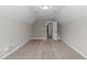 Spacious finished attic featuring neutral walls and carpet with a single-door closet at 1111 Barrow Nook Ct, Apex, NC 27502