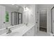 Bright bathroom with dual sinks, glass shower, and a separate soaking tub at 1111 Barrow Nook Ct, Apex, NC 27502