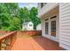 View of the stained deck overlooking the backyard and detached living space at 1111 Barrow Nook Ct, Apex, NC 27502