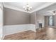 Dining room featuring hardwood floors and decorative trim at 1111 Barrow Nook Ct, Apex, NC 27502