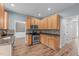 Kitchen featuring stainless steel appliances, ample cabinet space, and wood-look floors at 1111 Barrow Nook Ct, Apex, NC 27502