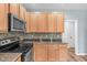 Kitchen featuring stainless steel appliances, granite countertops, and ample cabinet space at 1111 Barrow Nook Ct, Apex, NC 27502