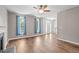 Bright living room with hardwood floors, natural light, and a fireplace at 1111 Barrow Nook Ct, Apex, NC 27502