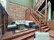 Back deck featuring a modern seating area and an exterior staircase at 1113 Bexley Hills Bend Bnd, Apex, NC 27502