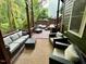 Cozy back deck featuring patio furniture with forest views at 1113 Bexley Hills Bend Bnd, Apex, NC 27502
