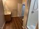 Bright bathroom featuring a vanity, shower, and white door at 1113 Bexley Hills Bend Bnd, Apex, NC 27502